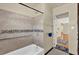 Updated bathroom with tiled shower, grab bar and modern fixtures at 320 Granada Dr, Winter Park, FL 32789
