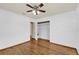 Bedroom with gleaming wood floors, ceiling fan and a closet at 320 Granada Dr, Winter Park, FL 32789