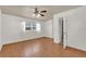 Bright bedroom with a ceiling fan, window and a closet with access to the bathroom at 320 Granada Dr, Winter Park, FL 32789