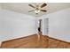 Bedroom featuring wood floors, ceiling fan and closet at 320 Granada Dr, Winter Park, FL 32789