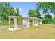 The property has a garage and carport, providing ample parking and storage solutions for the homeowners at 320 Granada Dr, Winter Park, FL 32789