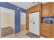 The kitchen features updated appliances, wood cabinetry and adjoining dining room at 320 Granada Dr, Winter Park, FL 32789