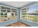 A sunroom featuring tile floors and large windows at 320 Granada Dr, Winter Park, FL 32789