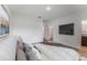 Bedroom featuring a large television, walk-in closet, and neutral decor at 3389 Sw 126Th Lane Rd, Ocala, FL 34473