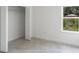 Bright bedroom featuring a window with a view and a spacious closet at 3389 Sw 126Th Lane Rd, Ocala, FL 34473