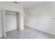 This bedroom has an open closet, and a door that leads to another room at 3389 Sw 126Th Lane Rd, Ocala, FL 34473