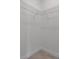 Empty walk-in closet features wire shelving and tile flooring at 3389 Sw 126Th Lane Rd, Ocala, FL 34473