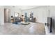 Bright living room with tile floors, neutral paint, and comfortable seating arrangement at 3389 Sw 126Th Lane Rd, Ocala, FL 34473