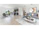 Open concept living space with kitchen island, dining area, and comfortable living room seating at 3389 Sw 126Th Lane Rd, Ocala, FL 34473