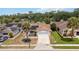 Aerial view of a home with a brown roof and solar panels in a residential area at 357 Kantor Blvd, Casselberry, FL 32707