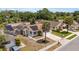 Aerial view showcasing a residential home with a well-manicured lawn and solar panels on the roof at 357 Kantor Blvd, Casselberry, FL 32707
