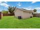 Expansive backyard with lush green grass and a partial fence at 357 Kantor Blvd, Casselberry, FL 32707