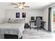 Bedroom featuring grey floors, a ceiling fan, and a sliding glass door to backyard at 357 Kantor Blvd, Casselberry, FL 32707