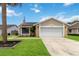 Charming single Gathering home boasts stone accents and a well maintained lawn at 357 Kantor Blvd, Casselberry, FL 32707