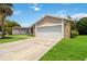 This home offers a well manicured lawn with an asphalt driveway to the garage at 357 Kantor Blvd, Casselberry, FL 32707