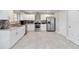 Bright kitchen featuring stainless steel appliances, granite countertops, and white cabinetry at 357 Kantor Blvd, Casselberry, FL 32707