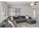 Bright living room with hardwood floors, a ceiling fan, and a gray sofa at 357 Kantor Blvd, Casselberry, FL 32707