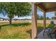 View of backyard with green grass, fenced perimeter, and covered patio area at 4027 Sunrise Ridge Blvd, Groveland, FL 34736