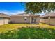 Expansive backyard showcasing lush grass and a patio area, perfect for outdoor enjoyment at 4027 Sunrise Ridge Blvd, Groveland, FL 34736