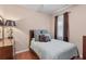 Charming bedroom with hardwood floors, warm colors, and natural light at 4027 Sunrise Ridge Blvd, Groveland, FL 34736