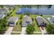 Stunning aerial view of a home with a backyard pond and lush landscaping at 4060 Longworth Loop, Kissimmee, FL 34744