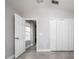 Spacious bedroom with neutral paint, tiled floor, high ceilings, and a closet at 4060 Longworth Loop, Kissimmee, FL 34744