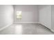 Bright bedroom with a large window, tiled floor, and a double door closet at 4060 Longworth Loop, Kissimmee, FL 34744