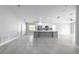 Spacious kitchen featuring an island, gray cabinets, stainless appliances, and tiled floors at 4060 Longworth Loop, Kissimmee, FL 34744