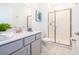 Bright bathroom featuring vanity, shower with glass doors, and decor at 4220 Paragraph Dr, Kissimmee, FL 34746