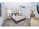 Serene bedroom with neutral tones, large windows, and access to an ensuite bathroom at 4220 Paragraph Dr, Kissimmee, FL 34746