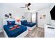 Bright bedroom featuring two beds with cartoon bedding and ceiling fan at 4220 Paragraph Dr, Kissimmee, FL 34746