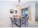 Cozy dining area with stylish lighting, table setting and sliding door access at 4220 Paragraph Dr, Kissimmee, FL 34746