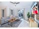 Comfortable living room features a modern sofa and access to an outdoor pool at 4220 Paragraph Dr, Kissimmee, FL 34746