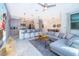 Bright living room with a modern kitchen and comfortable seating area at 4220 Paragraph Dr, Kissimmee, FL 34746