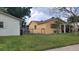 Side view of home showing fenced backyard at 4619 Salvia Dr, Orlando, FL 32839