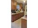 Well-lit kitchen features ample counter space and wood cabinetry and mosaic backsplash at 4619 Salvia Dr, Orlando, FL 32839