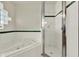 Bathroom featuring soaking tub and walk-in shower with glass door at 466 Drexel Ridge Cir, Ocoee, FL 34761