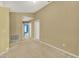 Spacious room featuring neutral walls and carpeting, with hallway and other rooms visible through doorways at 466 Drexel Ridge Cir, Ocoee, FL 34761