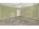 Bedroom featuring carpet flooring, green walls and a ceiling fan with natural light at 466 Drexel Ridge Cir, Ocoee, FL 34761