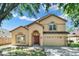 Charming two-story home featuring a well-manicured lawn and a classic architectural design at 466 Drexel Ridge Cir, Ocoee, FL 34761