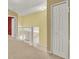 Upstairs hallway with view of lower floor and stairs and a beige carpet at 466 Drexel Ridge Cir, Ocoee, FL 34761