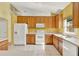 Well-lit kitchen with tile floors, modern appliances, and ample counter space for cooking at 466 Drexel Ridge Cir, Ocoee, FL 34761