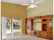 Large living room showcasing vaulted ceiling, carpet, and built-in entertainment center at 466 Drexel Ridge Cir, Ocoee, FL 34761