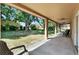 Covered patio offers shade with views of the spacious yard and lush landscaping at 466 Drexel Ridge Cir, Ocoee, FL 34761