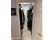 Well-organized walk-in closet with ample storage space and wood-look flooring at 4800 S Semoran Blvd # 101, Orlando, FL 32822