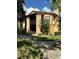 Exterior shot of a well-maintained condo, showcasing its architecture and verdant surroundings at 4800 S Semoran Blvd # 101, Orlando, FL 32822