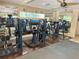 Well-equipped community gym featuring various weight machines and mirrors at 4800 S Semoran Blvd # 101, Orlando, FL 32822