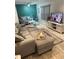 Comfortable living room features a large sectional couch, stylish decor, and a mounted television at 4800 S Semoran Blvd # 101, Orlando, FL 32822
