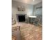 Inviting living room with a fireplace, round table, and tile floors offering a comfortable and stylish living area at 4800 S Semoran Blvd # 101, Orlando, FL 32822