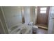 A full bathroom with a vanity, and a tiled shower, provides convenience and functionality at 4906 Gifford Blvd, Orlando, FL 32821